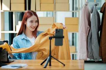 Entrepreneur Showcasing Clothes for Online Store