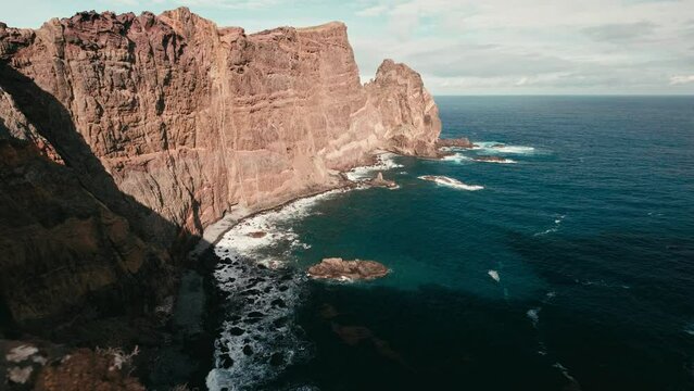 Aerial view of a spectacular bay at Vereda da Ponta de  Sao Lourenco Hike, Madeira, Portugal. Camera panning from top to bottom.