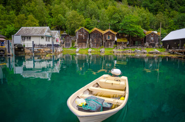 Obraz premium View on the coast and port of Geirangerfjord in town Geiranger, one of the most beautiful fjords in Norway
