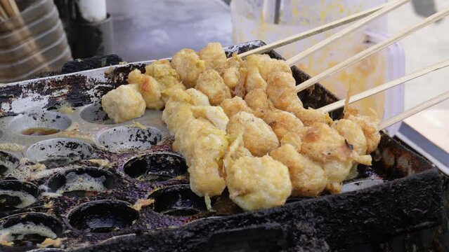 Making cilor, made from tapioca flour with macaroni and egg. Cilor is an Indonesian street food that is currently popular, especially among school children.