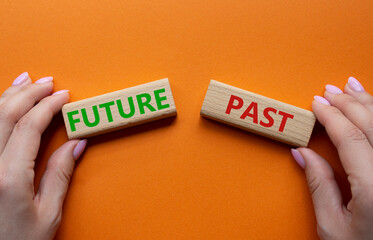 Future or Past symbol. Concept word Future or Past on wooden blocks. Businessman hand. Beautiful...