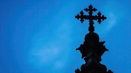 Fototapeta na wymiar Divine silhouette - church cross against blue sky, religious symbolism
