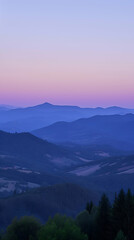 Sunset in the mountains, landscape at twilight with layers of hills and a gradient sky from blue to pink hues