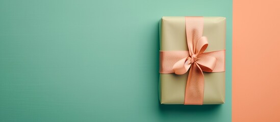 a pink bow on a gift box
