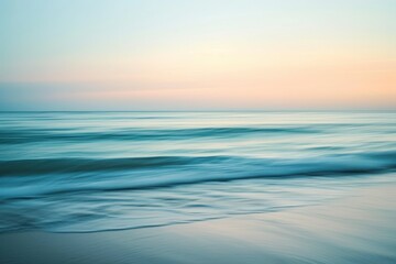 Serene ocean waves captured at sunset under a gradient sky