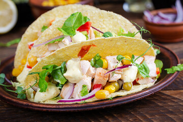 Mexican tacos with chicken meat, corn and salsa. Healthy tacos. Diet menu. Mexican taco.