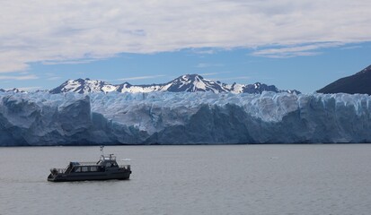 Sky, mountains, glacier and boat