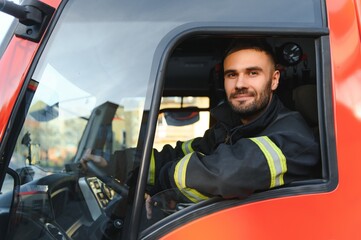 Fototapeta na wymiar Driver of a fire truck in action