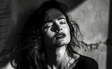 Black and white noir beauty, female in dramatic light. Monochromatic post-modern young woman portrait, high-contrast black and white, sharp angles and shadows.