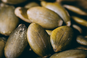 Hulled pumpkin seeds in a large pile. Pumpkin seeds