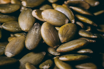 Hulled pumpkin seeds in a large pile. Pumpkin seeds
