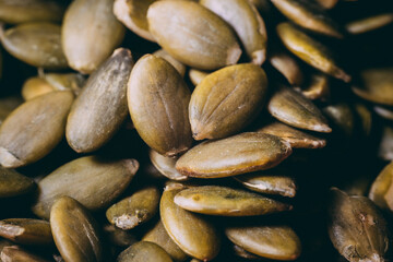 Hulled pumpkin seeds in a large pile. Pumpkin seeds
