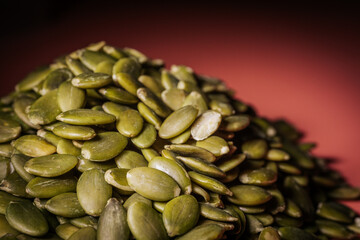 Hulled pumpkin seeds in a large pile. Pumpkin seeds