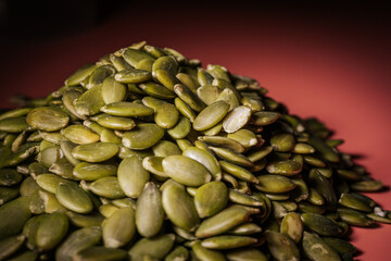 Hulled pumpkin seeds in a large pile. Pumpkin seeds