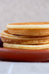 Stack of pancakes isolated on light background - 734212750