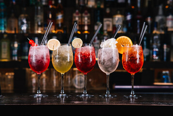 Mix of colourful cocktails on a bar