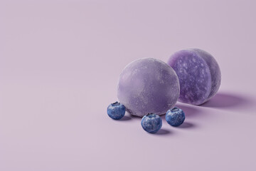 Mochi with blueberry. Light purple color background. space fpr text.