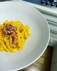 carbonara pasta, creamy egg sauce, bacon, grated cheese, carbohydrates