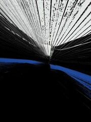 exploding blue and white stripes pattern on a 3D black background