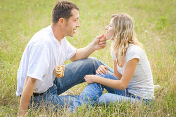 Fototapeta premium happy couple in love outdoors in the summer park