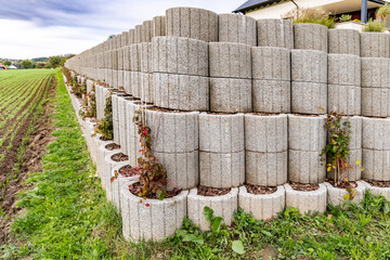 The new retaining wall is made of concrete blocks
