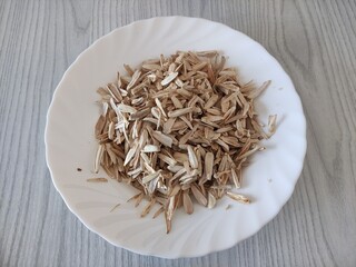 Husks from white sunflower seeds on a plate