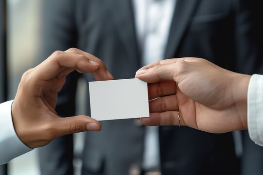 business people are holding white business cards and giving advice