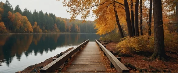 Fototapeten Autumn nature landscape, Lake bridge in fall forest, path way in gold woods © RIDA BATOOL