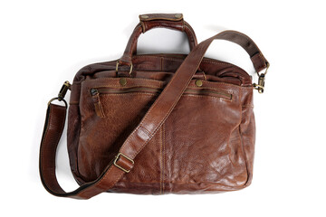 Naklejka premium Brown briefcase bag with shoulder strap made of rough buffalo leather isolated on white background