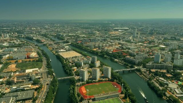 Aerial establishing shot of Saint-Denis, the Seine River and Stade de France stadium to the north of Paris. France