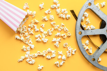 Vintage film reels and popcorn - cinema concept, top view