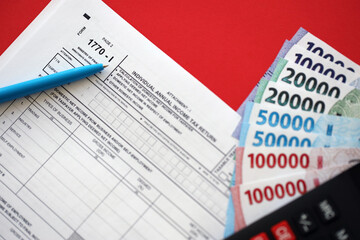 Indonesian tax form 1770-1 Individual Income Tax Return and pen on table close up