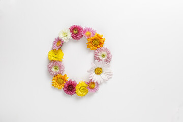 Letter O made of real natural flowers.