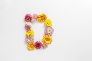 Letter D made of real natural flowers.