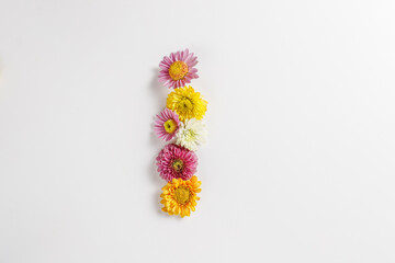 Letter I made of real natural flowers.