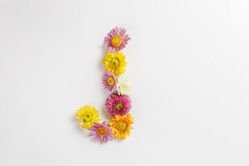 Letter J made of real natural flowers.