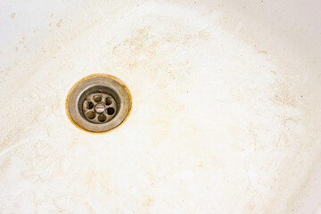 Dirty sink surface, dirty dishwasher with stains and grease.