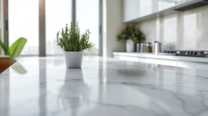 Mockup space on a luxury white marble tabletop with a blurred modern minimal white kitchen