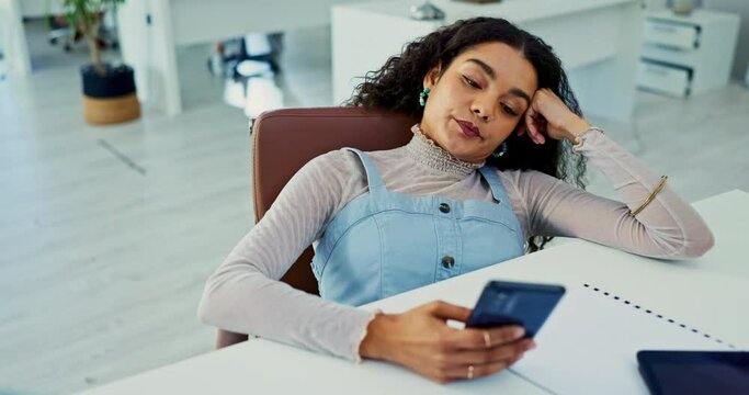 Phone, bored and tired with business woman at desk in office with fatigue or exhaustion from work. Mobile, burnout or social media distraction and frustrated or moody young employee in workplace
