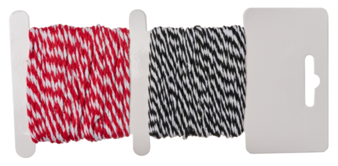 Red and black decorative thread wound on a cardboard sheet