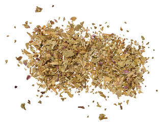 Crushed dry basil leaves on isolated background