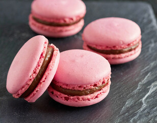 Pink macaroons on black slate
