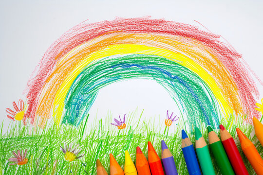 Colorful rainbow over a green meadow 4 year old's simple scribble colorful juvenile crayon outline drawing