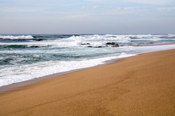 waves on the beach, sand with blue sky