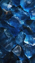 A full frame texture photograph showcasing a close-up view of a pile of blue glass chips resting on top of a table.