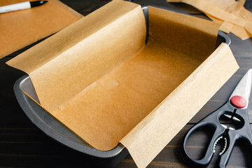 Loaf Pan Lined with Unbleached Parchment Paper: Bread pan lined with trimmed baking paper with...