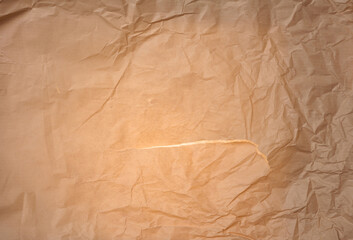 Crumpled brown parchment paper, full frame