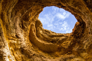 Hole in the top of Benagil cave, Algarve, Portugal - 734299318