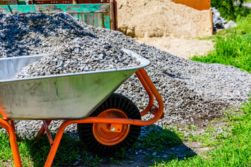 Wheelbarrow full of rubble at the construction site