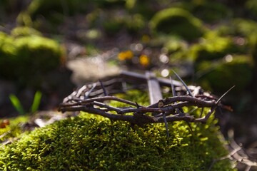 Christian cross and crown of thorns. Easter concept.